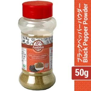 A 50g clear shaker bottle of Ambika Black Pepper Powder with a red cap, featuring finely ground spice inside and an orange label with Japanese and English text.