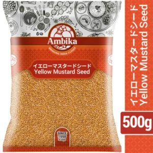 A 500g plastic pouch of Ambika Yellow Mustard Seeds featuring an orange patterned background and golden-yellow whole seeds visible through a large clear product window.