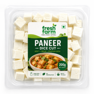 A transparent zip bag filled with 200g of diced white paneer cubes on a wooden counter.