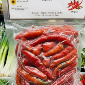 Packaged 200g bag of Himawari frozen Vietnamese red chili peppers on display at a supermarket.